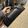 Alaïa Le Teckel Grained Leather Clutch in Black