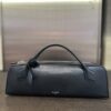 Alaïa Le Teckel Grained Leather Clutch in Black