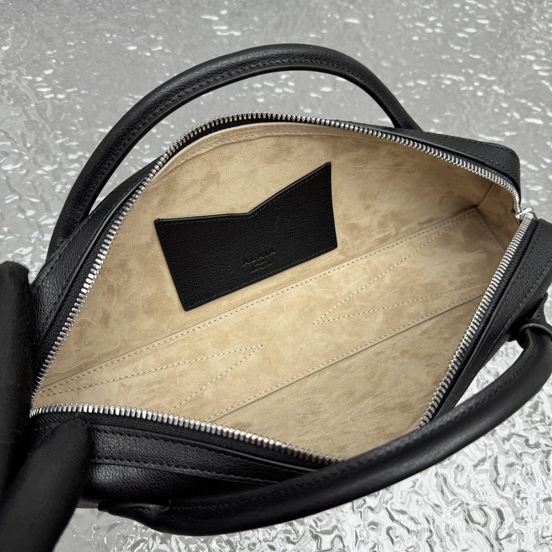 Black leather clutch bag Alaia LE TECKEL at the Park
