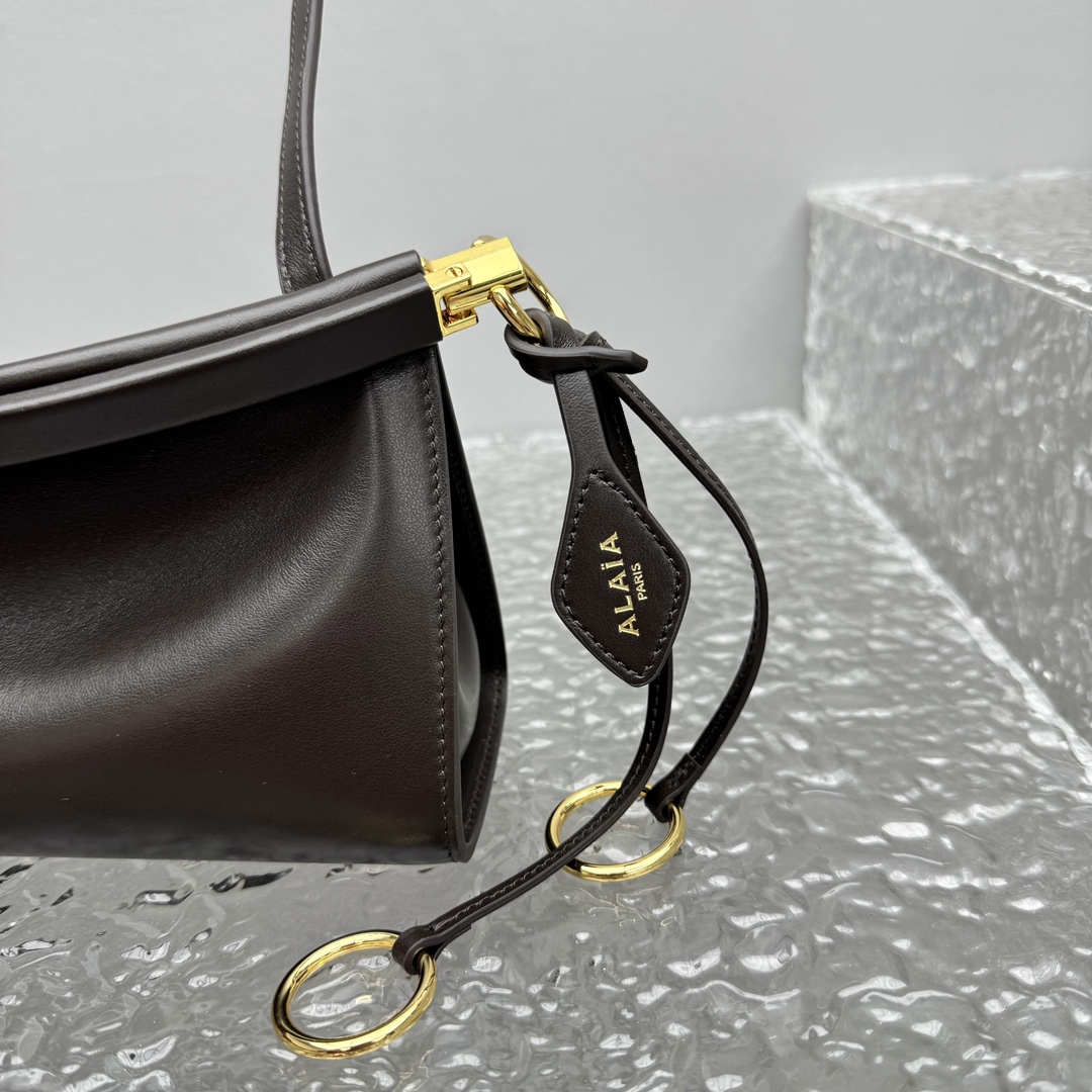Alaïa Small Le Click East West Shoulder Bag in Black