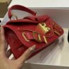 Balmain - Blaze red leather baguette bag with metal logo