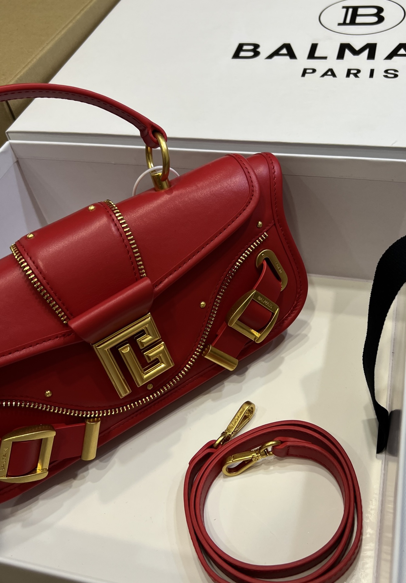 Balmain - Blaze red leather baguette bag with metal logo