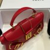 Balmain - Blaze red leather baguette bag with metal logo