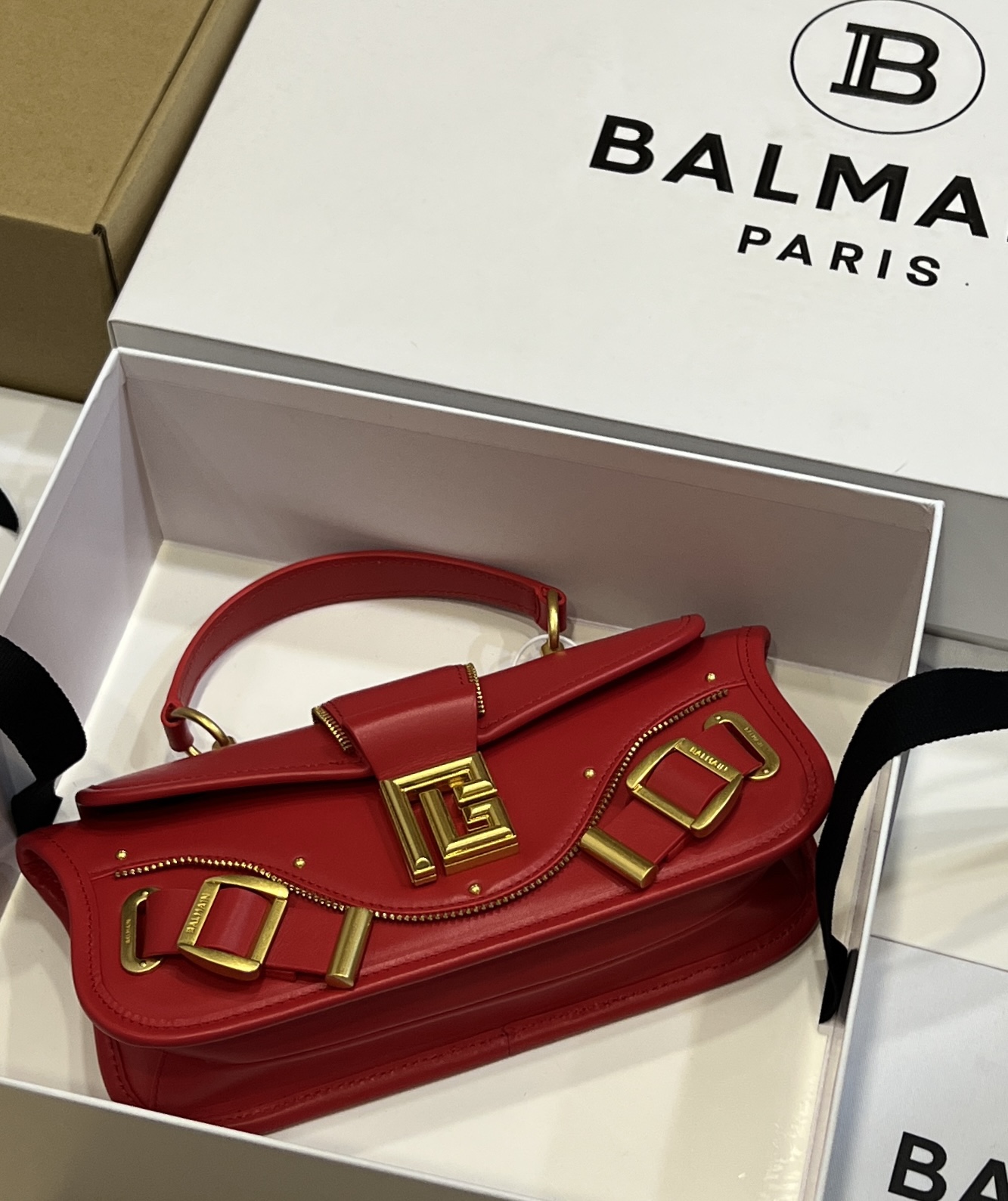 Balmain - Blaze red leather baguette bag with metal logo AN1AE795LSLX