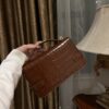 Balmain B-Buzz 24 monogrammed grained leather bag red brown
