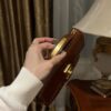 Balmain B-Buzz 24 monogrammed grained leather bag red brown
