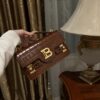 Balmain B-Buzz 24 monogrammed grained leather bag red brown