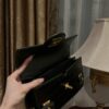 B Balmain B-Buzz 24 grained monogram leather Shoulder bag in black - Women |