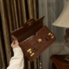Balmain B-Buzz 24 monogrammed grained leather bag red brown
