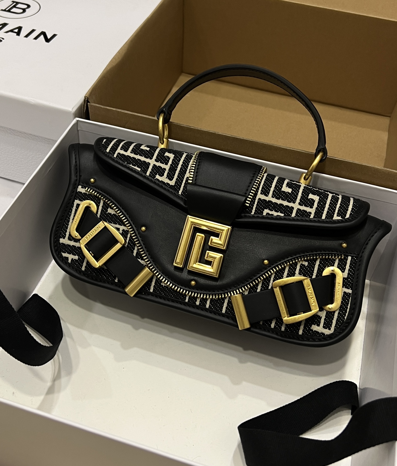 Balmain Blaze monogram-jacquard Leather Clutch Bag |