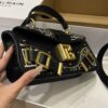 Balmain Blaze monogram-jacquard Leather Clutch Bag |