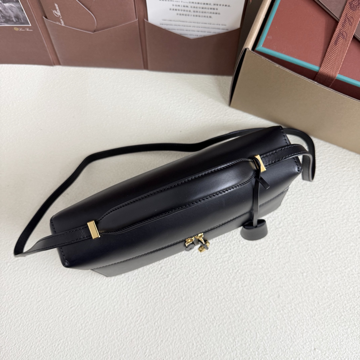 Extra L27 leather crossbody bag in black - Loro Piana |