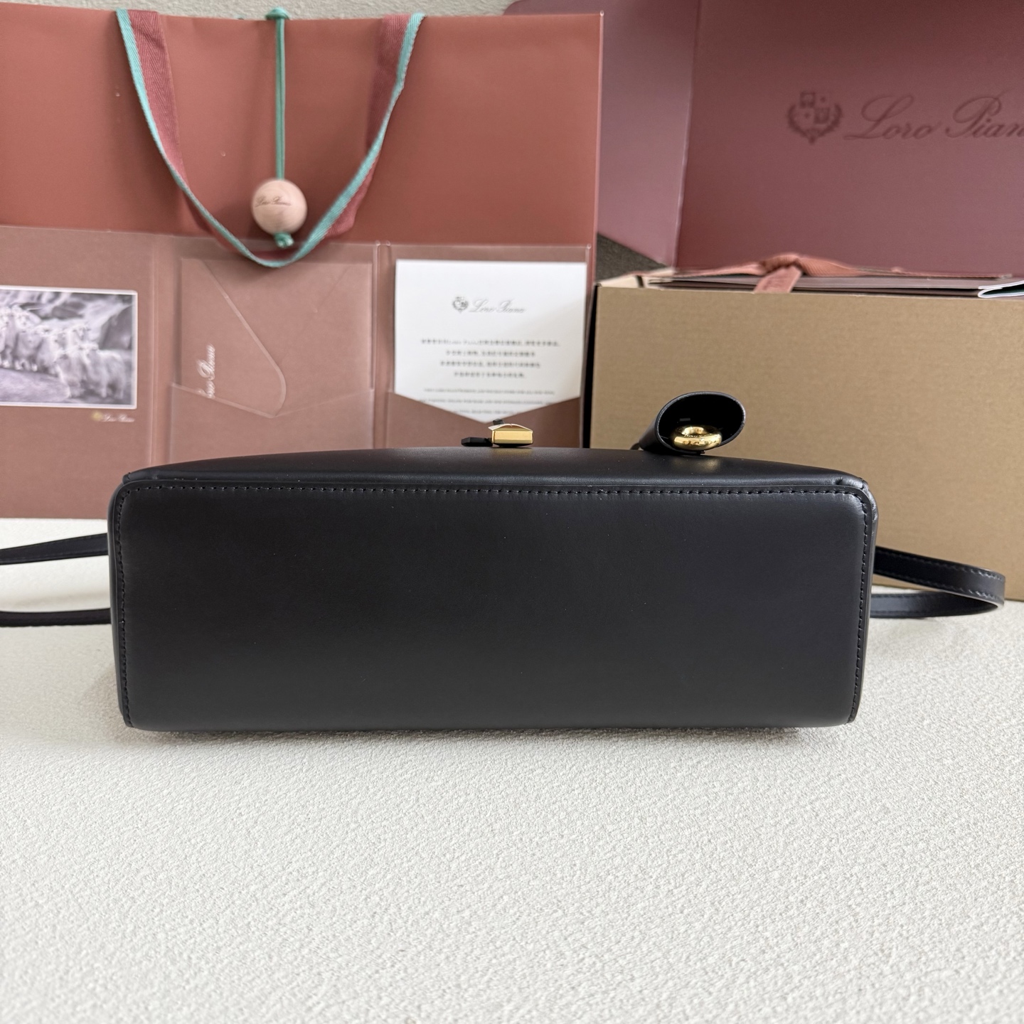 Extra L27 leather crossbody bag in black - Loro Piana |