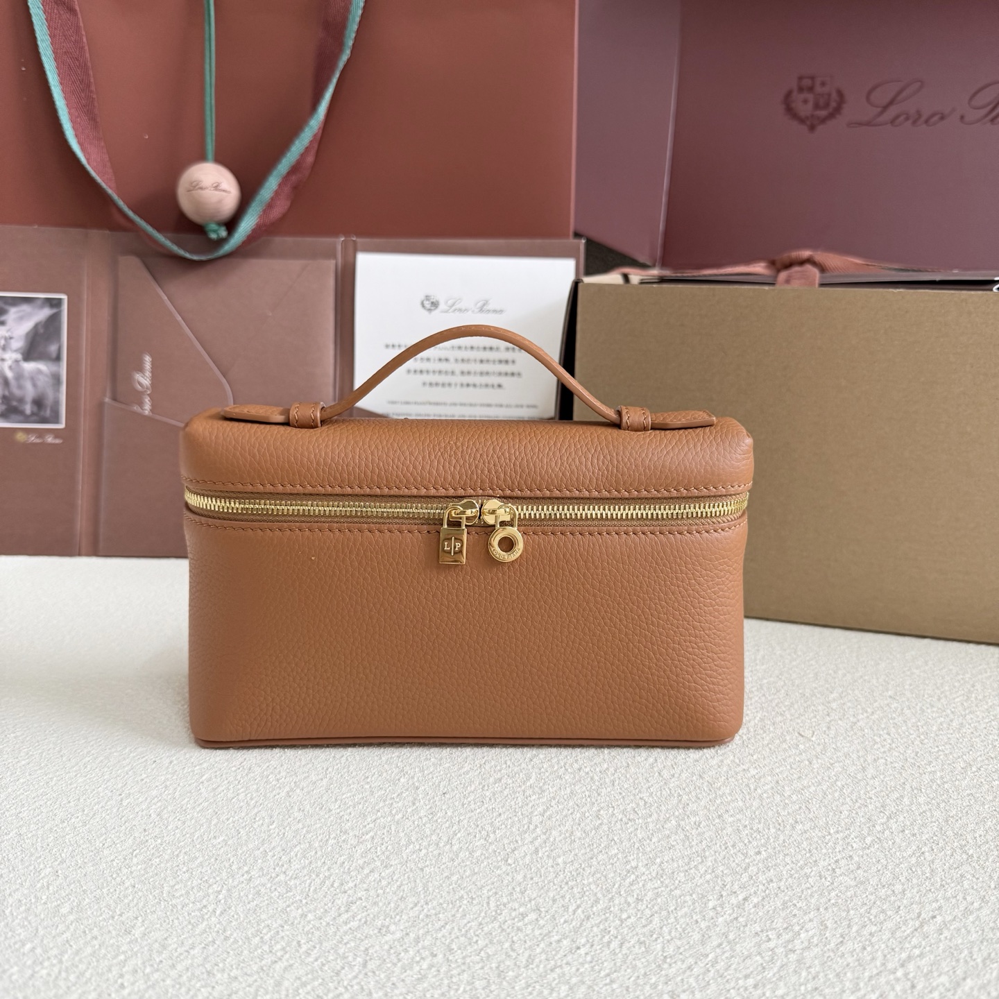 Extra pocket leather crossbody bag Loro Piana Orange in Leather – 501537