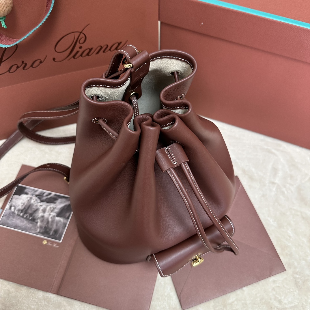 Loro Piana Drawstring Leather Backpack | red Brown